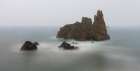 Spain. Ocean sea stack on misty coastline. Art Print